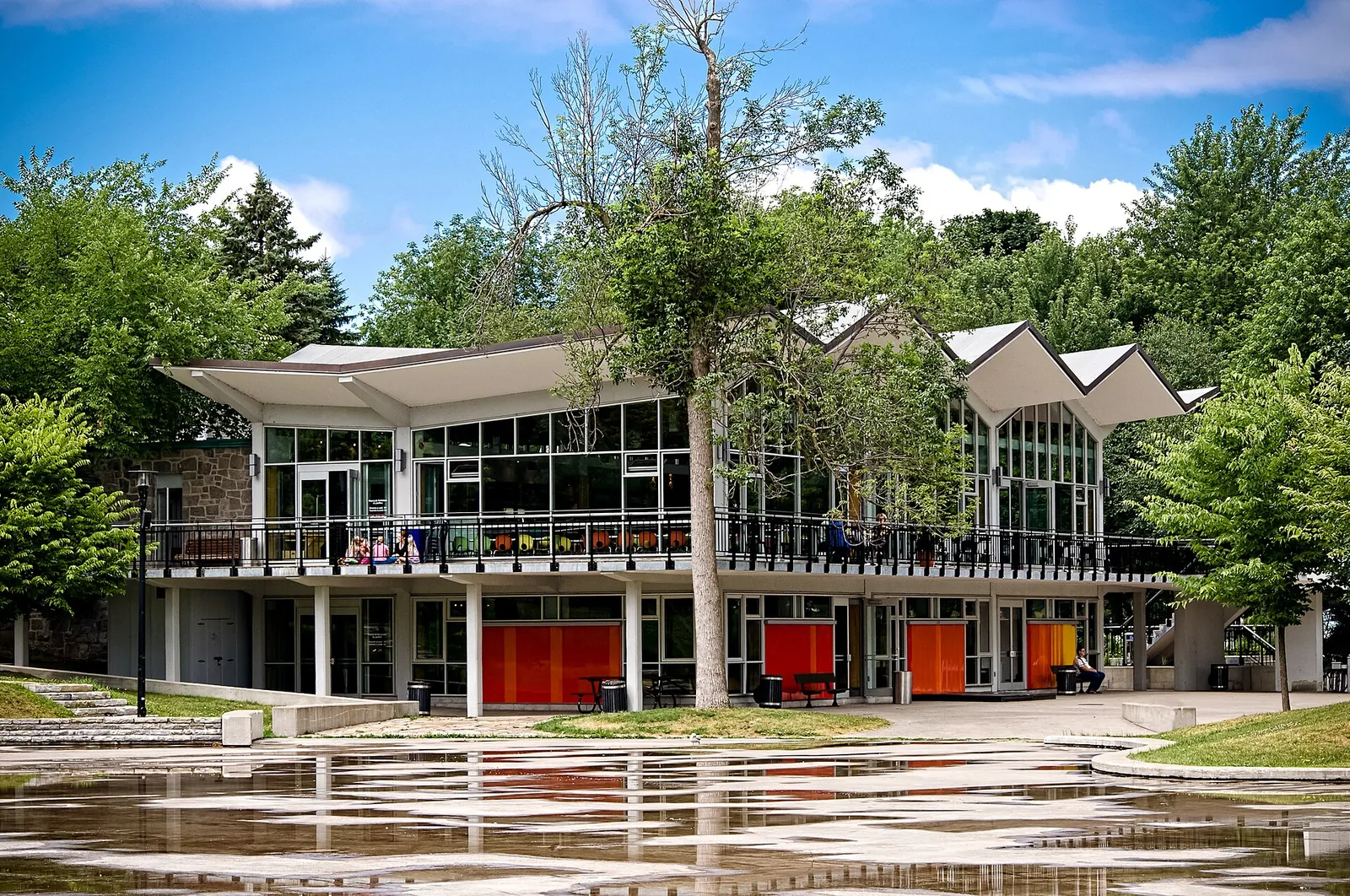 The Beaver Lake Pavilion on Mount Royal with its zigzag roof and glass walls on a sunny summer day