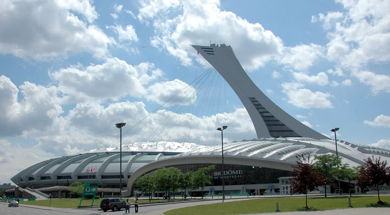 The Biodôme building at Olympic Park with the inclined Montreal Tower rising behind it