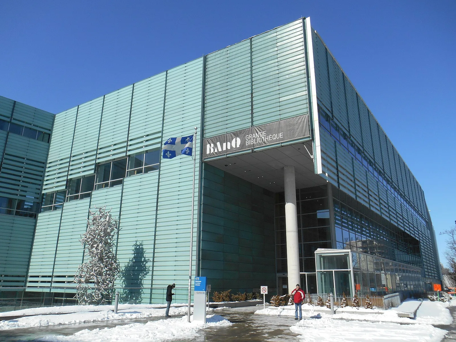 The glass-panelled Grande Bibliothèque of BAnQ in the Quartier Latin on a sunny winter day