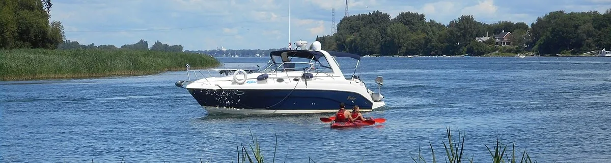 A boat anchored in a quiet bay in Parc national des Îles-de-Boucherville