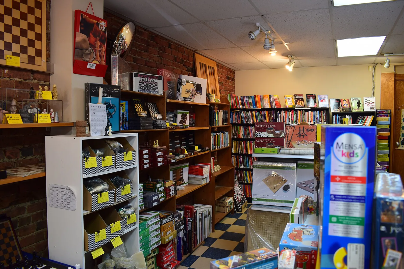 Shelves of board games, chess sets and puzzles inside an independent game shop in Montreal