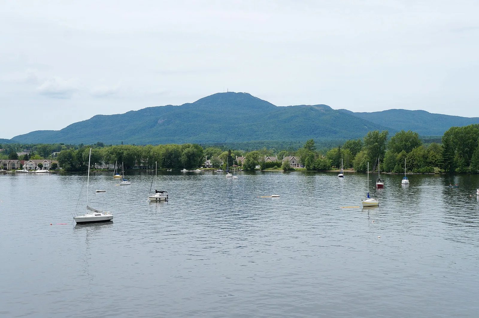 Sailboats on Lake Memphremagog at Magog with Mont Orford behind, in the Eastern Townships