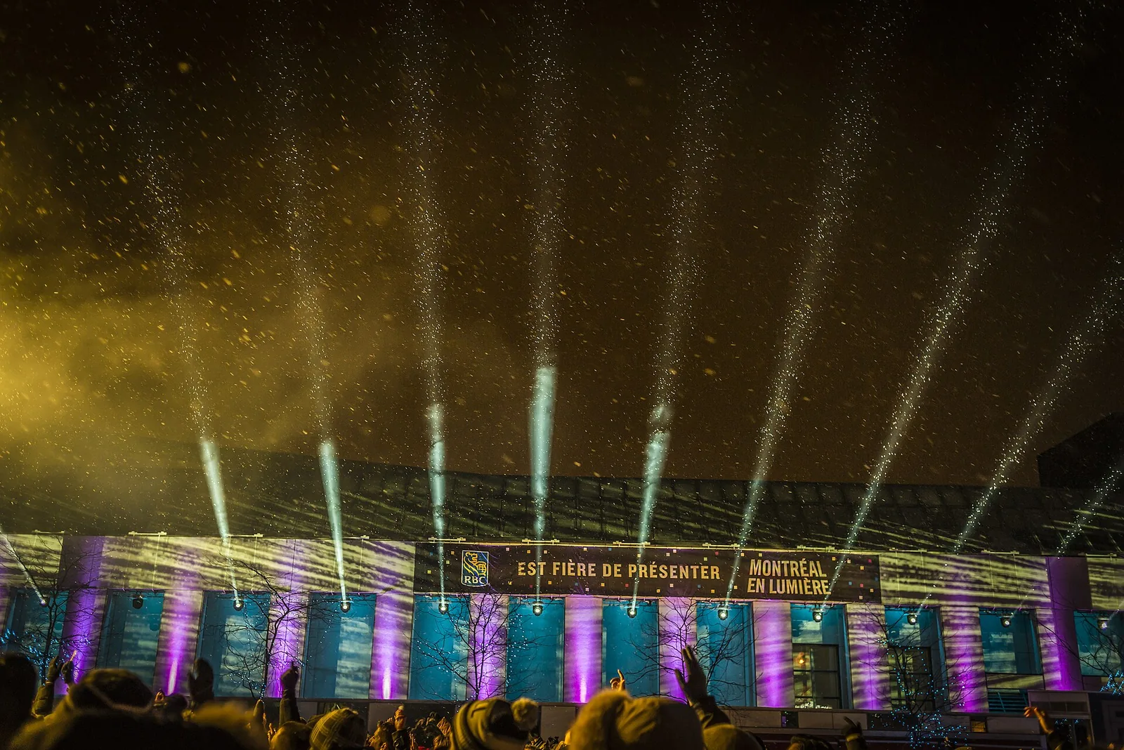 Light beams and sparks over the main stage at Montréal en Lumière during Nuit blanche