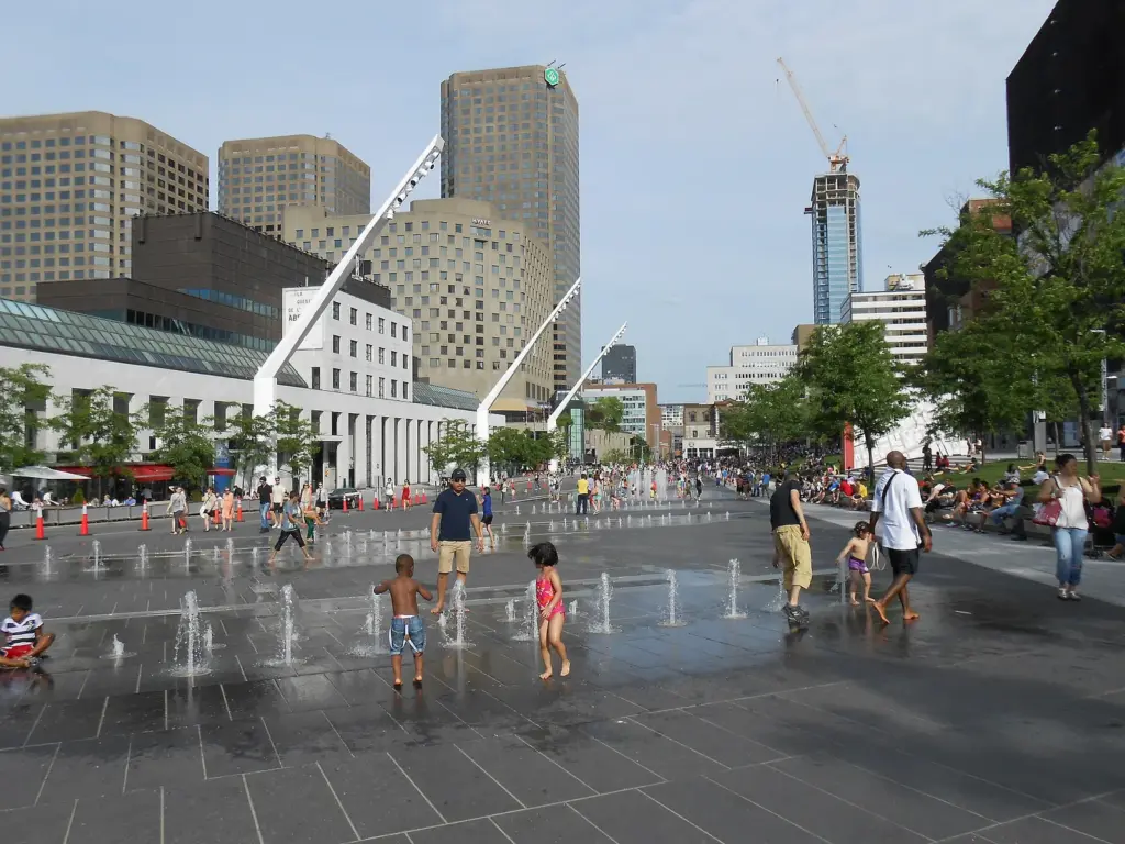 Children playing in the fountains on the Place des Festivals in Montreal's Quartier des Spectacles in summer
