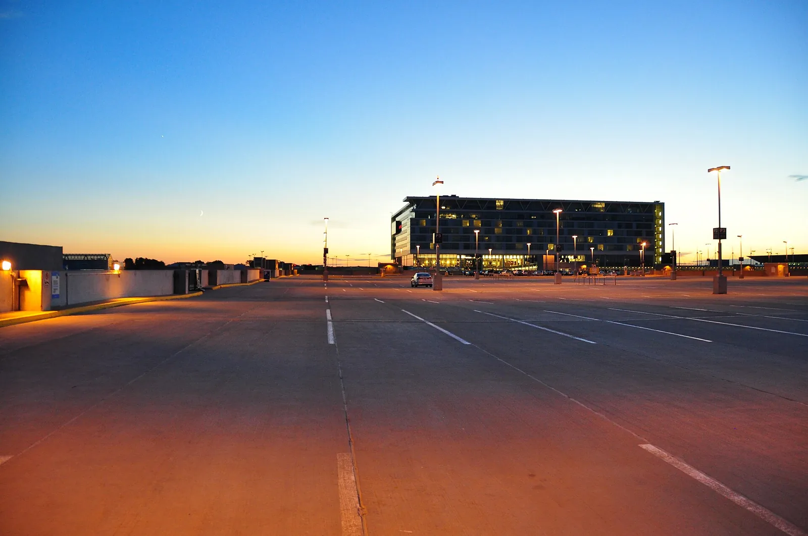 Montréal–Trudeau airport buildings lit up at dusk