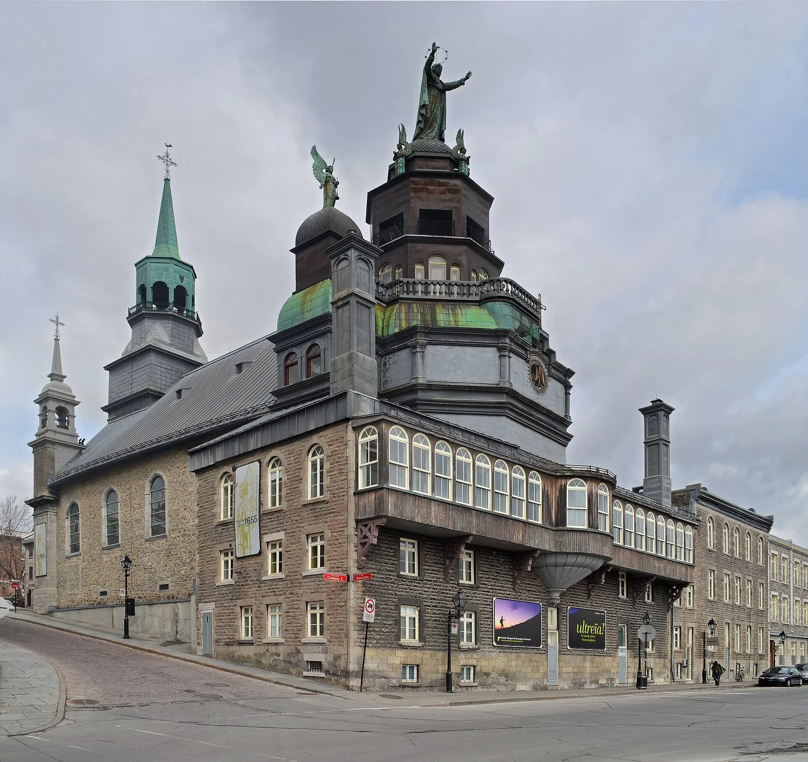 Notre-Dame-de-Bon-Secours Chapel with its green copper tower and statue of the Virgin facing the river