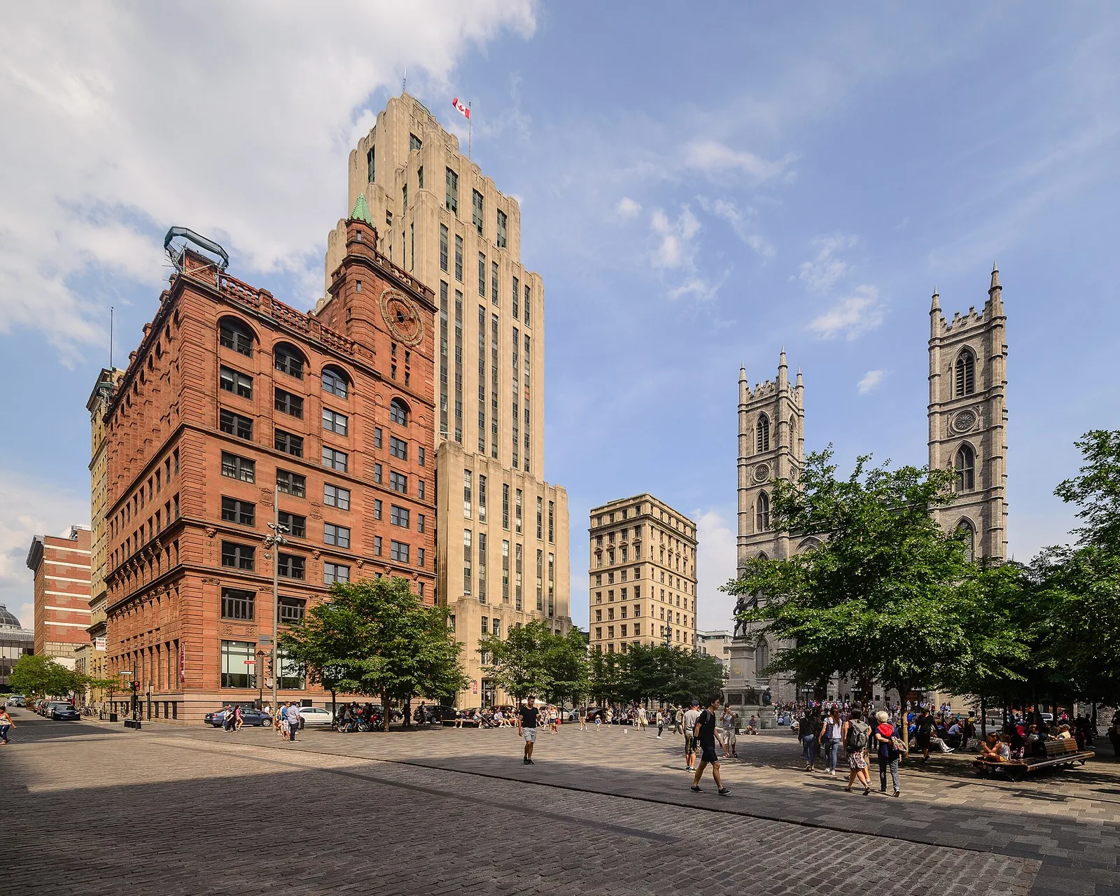 Place d'Armes in Old Montreal, the starting point for many Montreal tours, with the red sandstone New York Life Building