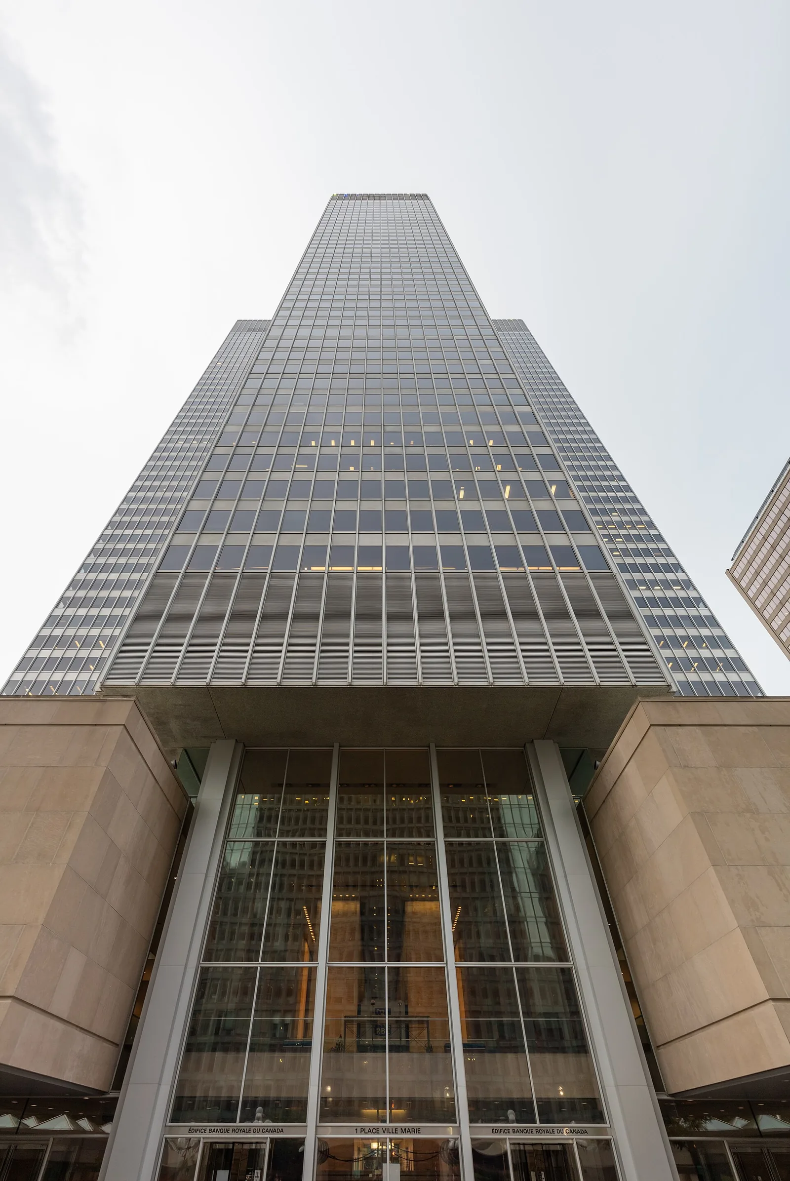 Looking up at the cruciform Place Ville Marie tower from its base in downtown Montreal