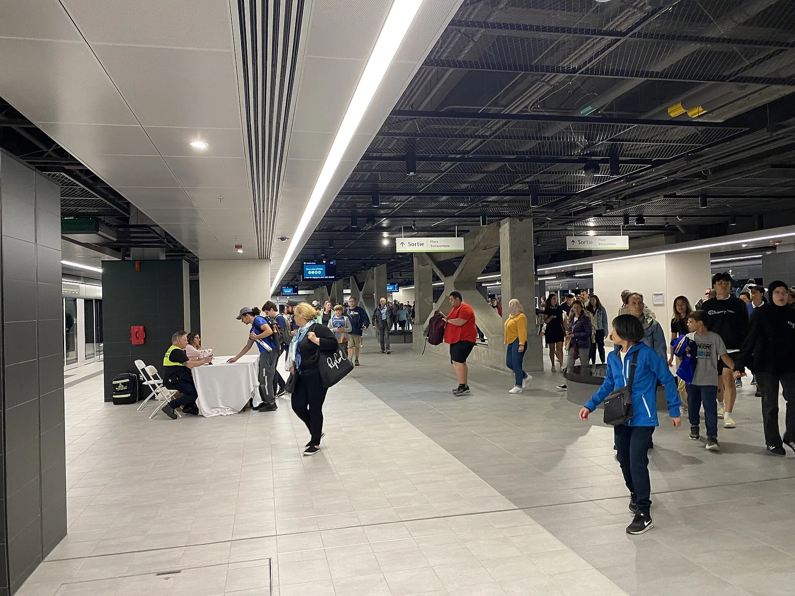 Passengers on the REM light-metro platform inside Central Station in downtown Montreal