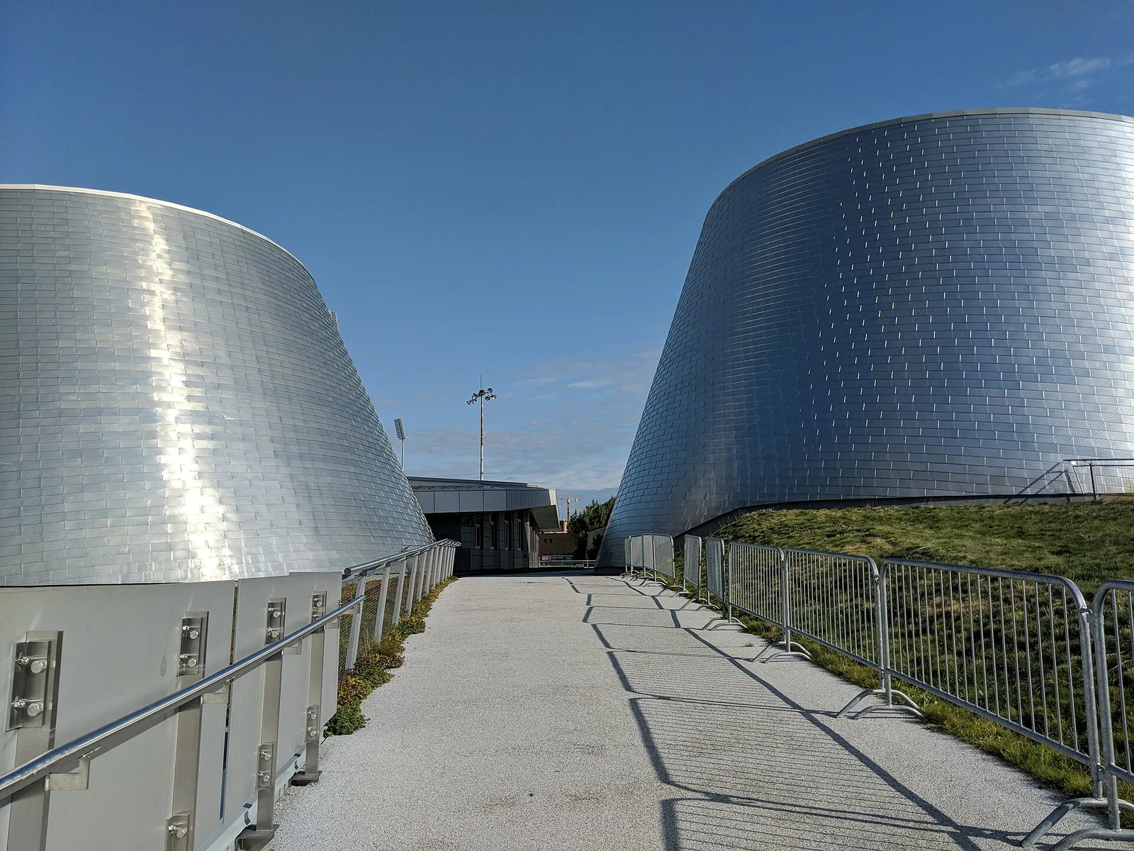 The two silver cone-shaped domes of the Rio Tinto Alcan Planetarium beside the Olympic Park