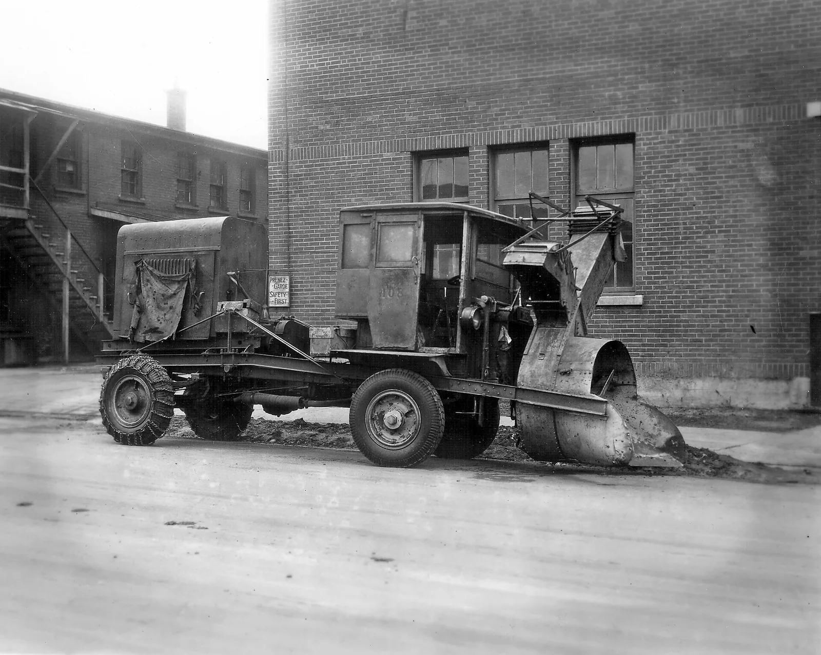 Early Sicard snowblower mounted on a truck in a Montreal street, from the city archives