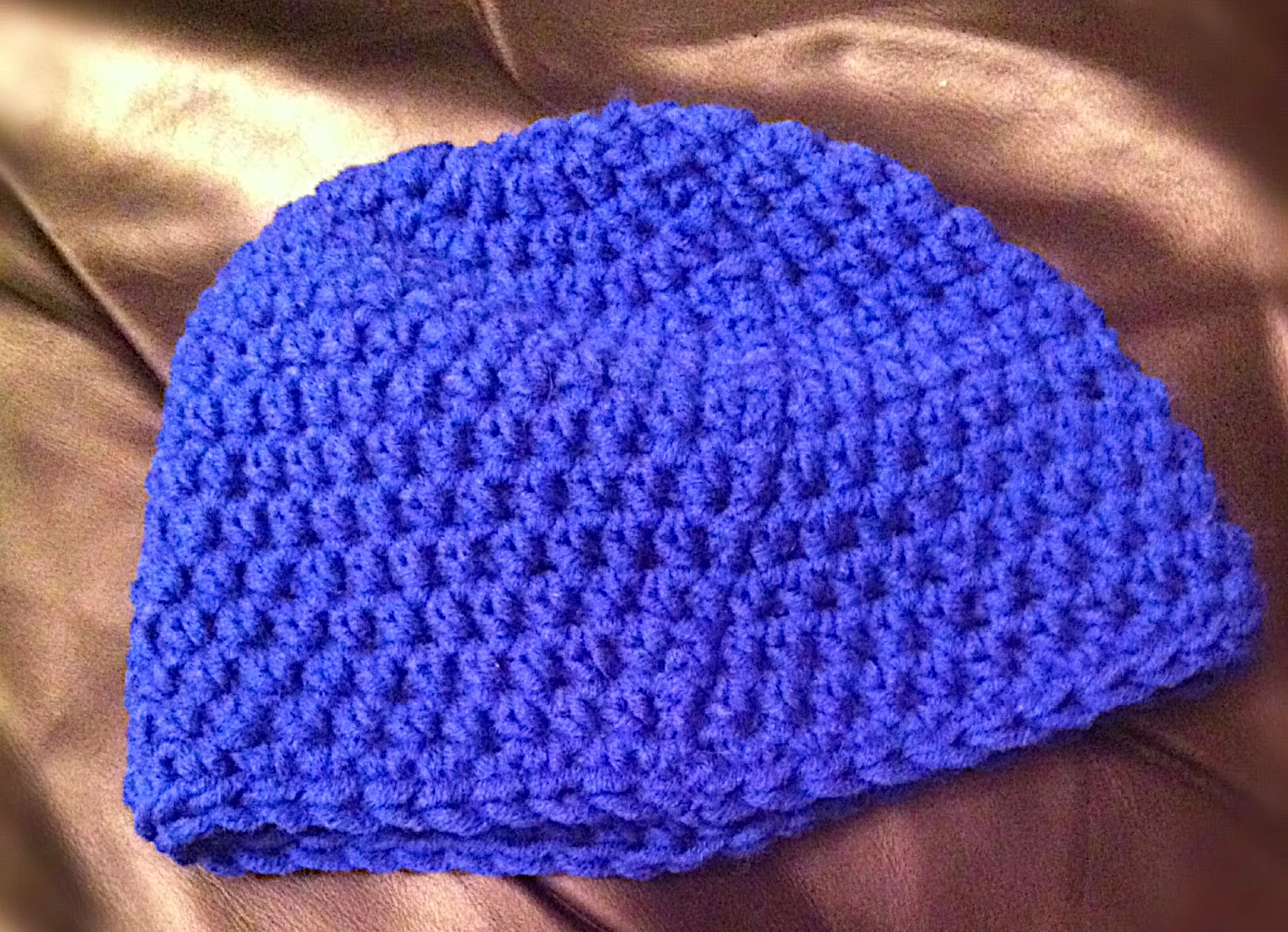 A blue hand-knitted tuque, the Canadian winter hat