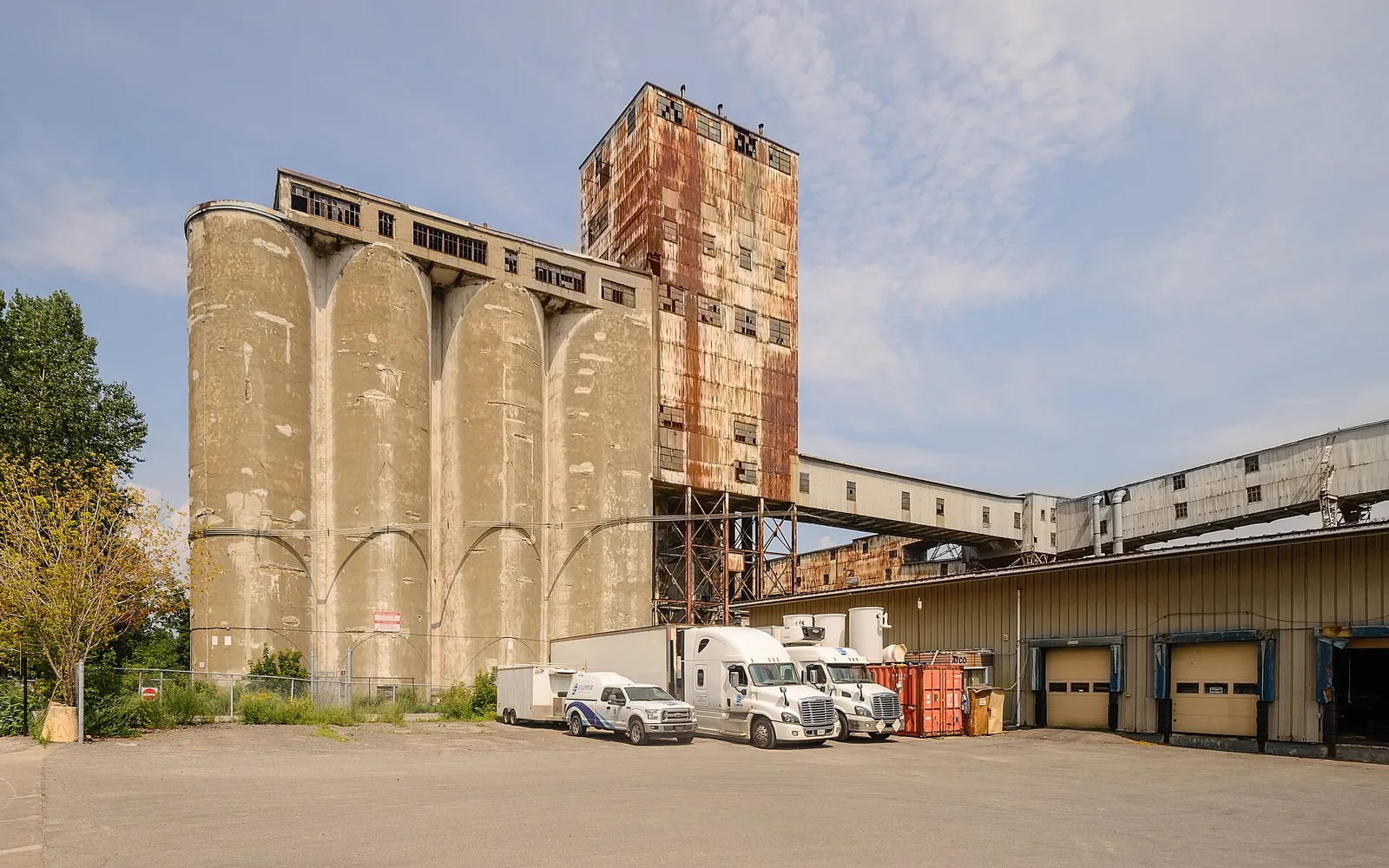 The concrete grain silos and rusted elevator tower of Silo No. 5 near the Old Port of Montreal